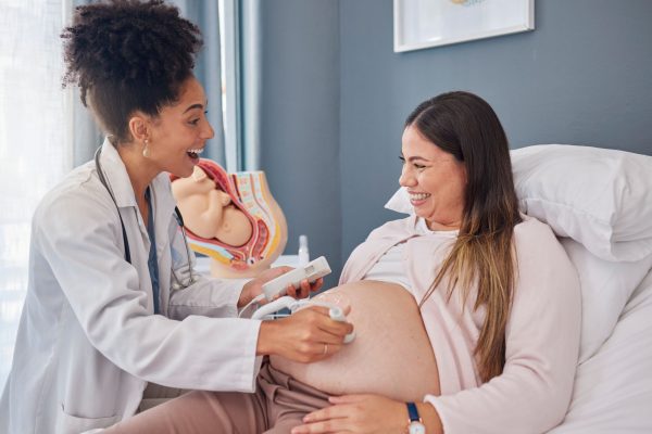 OBGYN performing ultrasound with pregnant woman in Greensboro NC